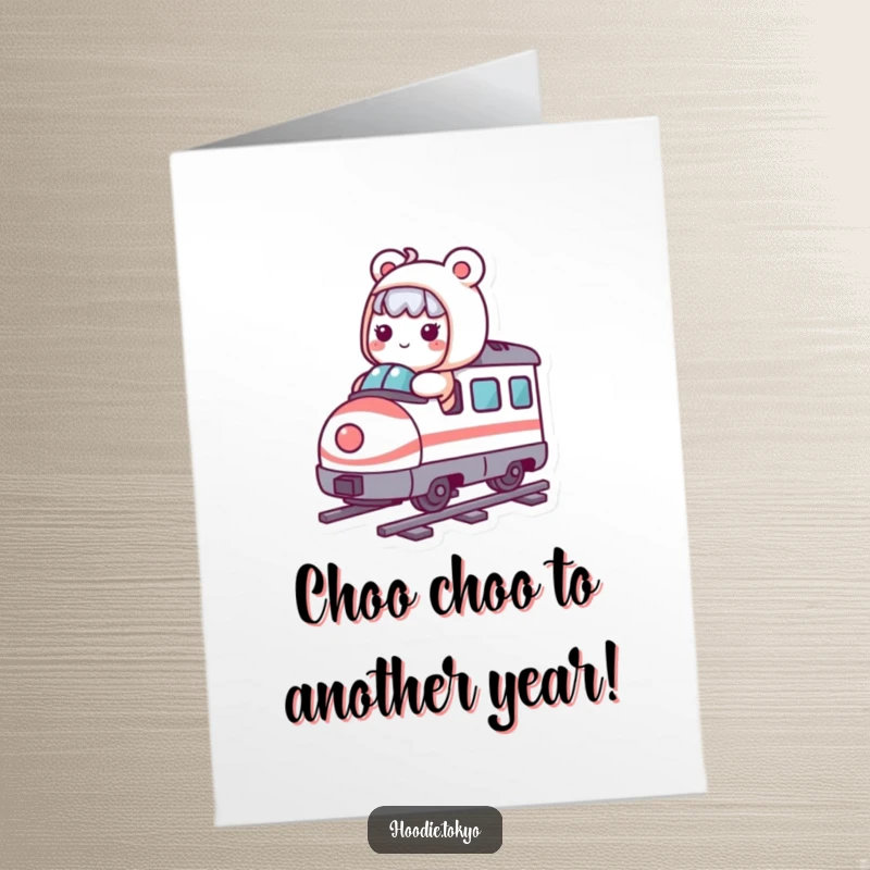 Funny Free Printable Birthday Card: Kawaii character joyfully riding a tiny, whimsical bullet train, ready for celebration.