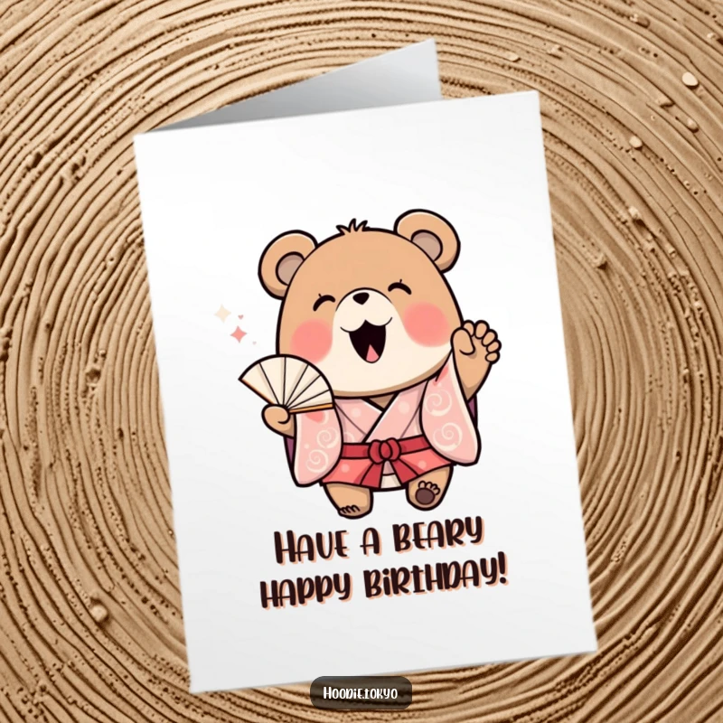 Funny Free Printable Birthday Card: A cheerful bear in a kimono waves a fan enthusiastically, sending birthday joy.